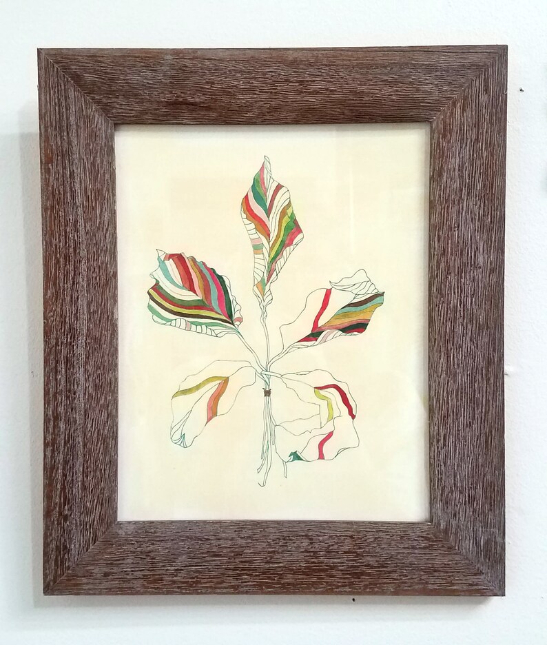 Peut inclure: Un dessin encadr&eacute; d'une feuille stylis&eacute;e avec des rayures color&eacute;es dans des tons de vert, rouge, jaune et marron.