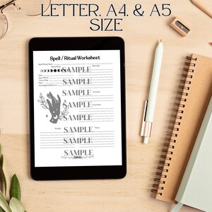 May include: A digital tablet displaying a "Spell/Ritual Worksheet" with sample text and a hand graphic. The tablet is on a wooden surface, accompanied by a pen, notebooks, and a sprig of leaves. Text at the top reads "LETTER. A4. & A5 SIZE."