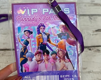 May include: A clear plastic VIP pass holder with a purple lanyard. The pass features a graphic of animated characters and text that reads "VIP PASS Kennedy's 8th Birthday" and "ALL ACCESS SEPT. 13, 2025".