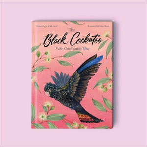 May include: Book cover featuring an illustration of a black cockatoo with one blue feather, flying against a pink background with white flowers and green leaves. The title of the book is "The Black Cockatoo with One Feather Blue".