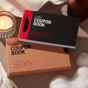 May include: Two small coupon books are shown, one black and one tan. The black book has a red spine and the words "Little COUPON BOOK" and "SEXY" printed in white and red. The tan book has the same text in the same colours.