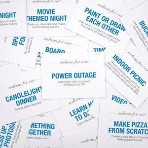 May include: A collection of white cards with blue text, each card has a different date night idea. Some of the ideas include "Movie Themed Night", "Candlelight Dinner", "Paint or Draw Each Other", "Indoor Picnic", and "Power Outage".