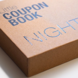 May include: A brown cardboard box with the text "Little Coupon Book" printed in black and "NIGHT" printed in silver foil.