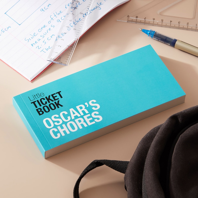May include: A turquoise blue book with the title "Little Ticket Book Oscar's Chores" printed in black and white.