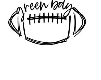 May include: A black and white illustration of a football with the words "green bay" written in cursive above it. The football is drawn with a simple outline and cross-hatching.