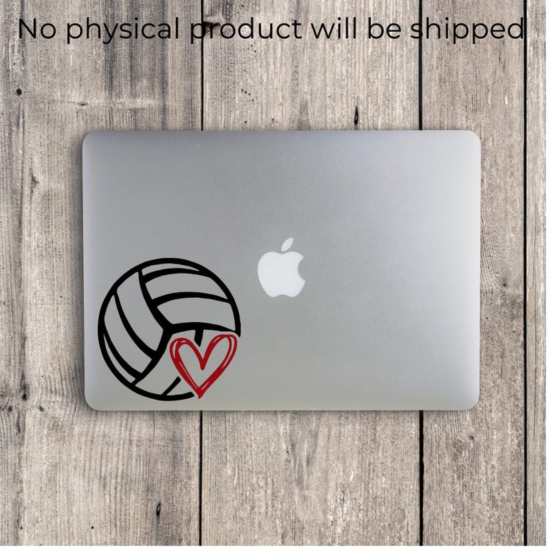Peut inclure: Un ordinateur portable argent&eacute; avec un autocollant en vinyle noir repr&eacute;sentant un ballon de volley-ball et un c&oelig;ur rouge dessin&eacute; &agrave; la main. Le texte "No physical product will be shipped" est imprim&eacute; en noir en haut de l'image.