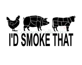 May include: A black graphic design featuring silhouettes of a chicken, a pig, and a cow, each divided into butcher cut sections. Below the animals, the text reads I'D SMOKE THAT in bold, black, capital letters. The design is on a white background.