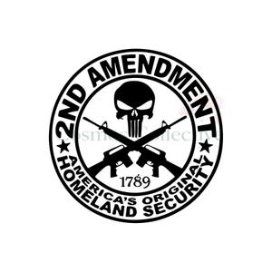 May include: A circular black and white decal featuring a skull graphic centered above two crossed rifles. The text reads 2ND AMENDMENT, AMERICA'S ORIGINAL HOMELAND SECURITY, and the year 1789, all enclosed within a bold circular border with two stars.
