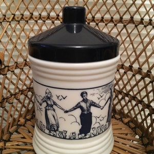 Vintage Dutch scene people holding hands glass cannister