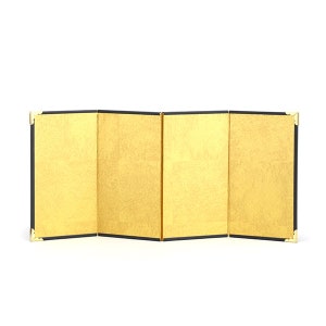 May include: A four-panel folding screen with a gold leaf design. The screen has a black border and gold corner accents. The panels are arranged in a zig-zag pattern, showcasing the gold leaf's texture and sheen against a white background.