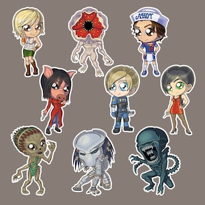 May include: A set of nine cartoon stickers featuring characters from popular horror and sci-fi franchises. The stickers include a female character with blonde hair, a creature with a large mouth, a female character with red hair, a male character with blue hair, a female character with black hair, a creature with a large head, a creature with a large mouth, a creature with a large head, and a creature with a large mouth.