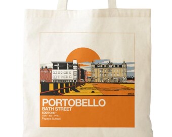 May include: A cream-colored canvas tote bag featuring a graphic print of a street scene in Portobello. The illustration shows buildings under a large orange sun, with the text PORTOBELLO, BATH STREET, EDDTONE, and Papaya Sunset printed below.