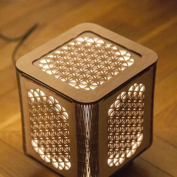 Japandi Japanese style wooden lamp with sacred geometry flower of life. Laser cutting.