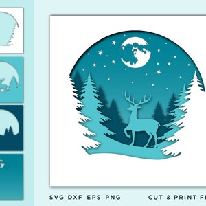 Puede incluir: Un diseño de arte en papel en capas que presenta un ciervo en un bosque bajo una luna llena y estrellas. La obra de arte está en tonos de azul y blanco, con el texto "SVG DXF EPS PNG" y "CUT & PRINT FILES".