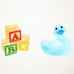May include: A stack of three wooden blocks with the letters A, B, and C painted on them. The blocks are in red, green, and yellow. A blue rubber duck is to the right of the blocks.