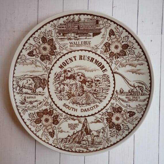 Vintage Mount Rushmore South Dakota Souvenir Plate Brown and White with Scenes of Wall Drug Badlands