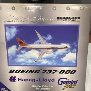 May include: A 1:400 scale diecast model of a Boeing 737-800 airplane in the livery of Hapag-Lloyd. The model is a limited edition and is made for collectors by collectors. The box features the Gemini Jets logo.