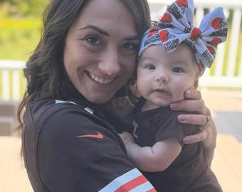 Custom made big bows and head wraps in your favorite team!