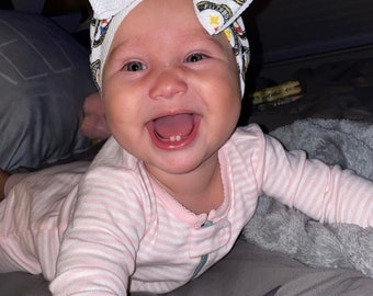 Custom made big bows and head wraps in your favorite team!