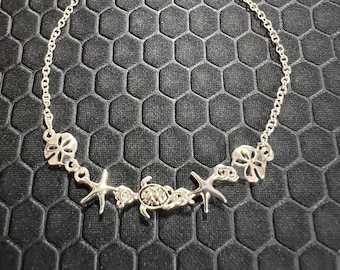 Turtle, Star Fish, and Sand Dollar Anklet Made of Sterling Silver