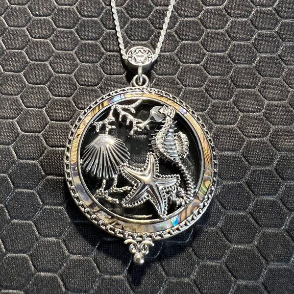 Sea Horse, Star Fish, and Seashell Locket That Opens Made of Sterling Silver