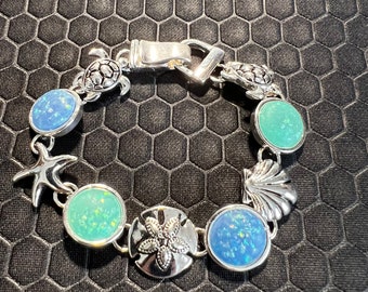 Turtle, Star Fish, and Shell Bracelet with Aqua and Blue Sea Glass Made of Sterling Silver