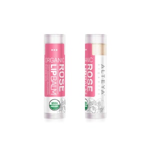 May include: Two tubes of Altea Organics Rose Lip Balm. The tube on the left is pink and says "Organic Rose Lip Balm with Organic Bulgarian Rose Oil" and has a USDA Organic seal. The tube on the right is white and says "Altea Organics Rose Lip Balm".