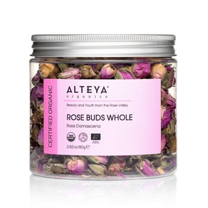 May include: A clear jar filled with dried pink rose buds. The jar has a silver lid and a pink label with the text "ALTEYA organics ROSE BUDS WHOLE". The jar contains 2.82oz/80g of rose buds.