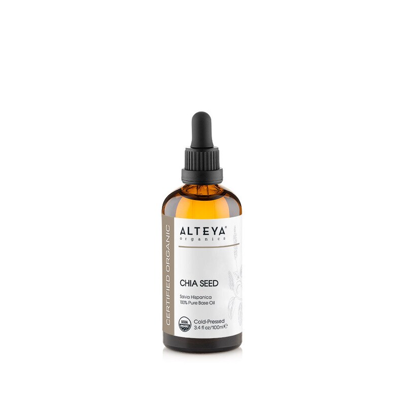 May include: A brown glass bottle with a black dropper top, containing certified organic chia seed oil. The bottle is labeled "ALTEYA organics" and "CHIA SEED". The label also states "Salvia Hispanica 100% Pure Base Oil" and "Cold-Pressed 3.4 fl oz/100ml".