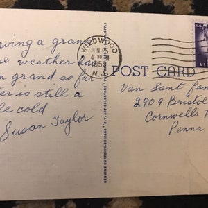 May include: A vintage postcard with a handwritten message that reads "Having a grand time weather has been grand so far water is still a little cold Susan Taylor". The postcard is addressed to Van Sant Family, 2909 Bristol Road, Cornwells Hgts, Penna. A 3&cent; US postage stamp with a picture of the Statue of Liberty is in the upper right corner.