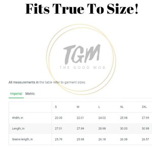 May include: Size chart for a t-shirt with measurements in inches for width, length, and sleeve length. Sizes include S, M, L, XL, and 2XL.
