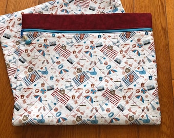Bolsa acolchada para proyectos de punto de cruz con temática playera