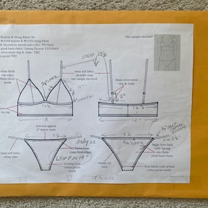 May include: A black satin bralette and matching string bikini set with a detailed diagram of the pattern pieces and measurements. The bra has a triangle shape with a 14.5 inch width and a 13 inch length. The string bikini has a 17.5 inch width and a 21 inch length. The diagram includes instructions for sewing the garment, including the use of a baby zig zag stitch and a clean finish seam.
