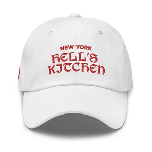 May include: White baseball cap with red embroidered text that reads "NEW YORK KELL'S KITCHEN"