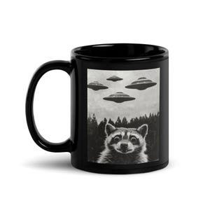 Funny Raccoon UFO Mug – Black Ceramic Alien Spaceship Cup – Surreal Animal Meme Gift for UFO Lovers, Quirky Raccoon Art Coffee Mug