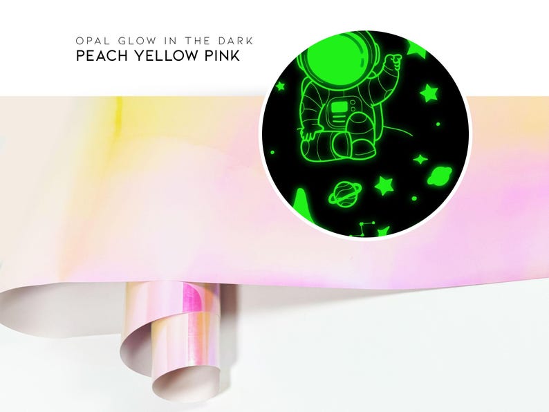 May include: A roll of glow-in-the-dark wallpaper with an astronaut and stars design. The wallpaper is peach, yellow, and pink.