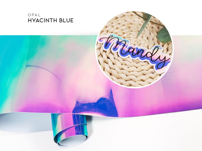 May include: A sheet of iridescent opal vinyl in a hyacinth blue color. The vinyl is folded in half and the top half is rolled up. The vinyl is a holographic material with a rainbow effect. The vinyl is a popular material for crafting and DIY projects.