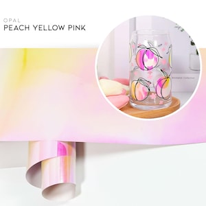 May include: A glass with a peach, yellow, and pink ombre design. The glass has a peach design with black outlines and pink flowers. The text "OPAL PEACH YELLOW PINK" is at the top of the image.