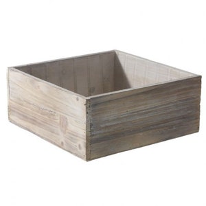 May include: A square wooden planter box with a light gray wash finish. The box is made of natural wood with visible grain and knots.