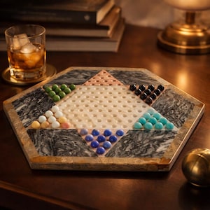 May include: A set of three ceramic mugs with a speckled, matte finish. The mugs are in shades of cream, light gray, and dark gray. Each mug has a simple, minimalist design, perfect for coffee or tea.