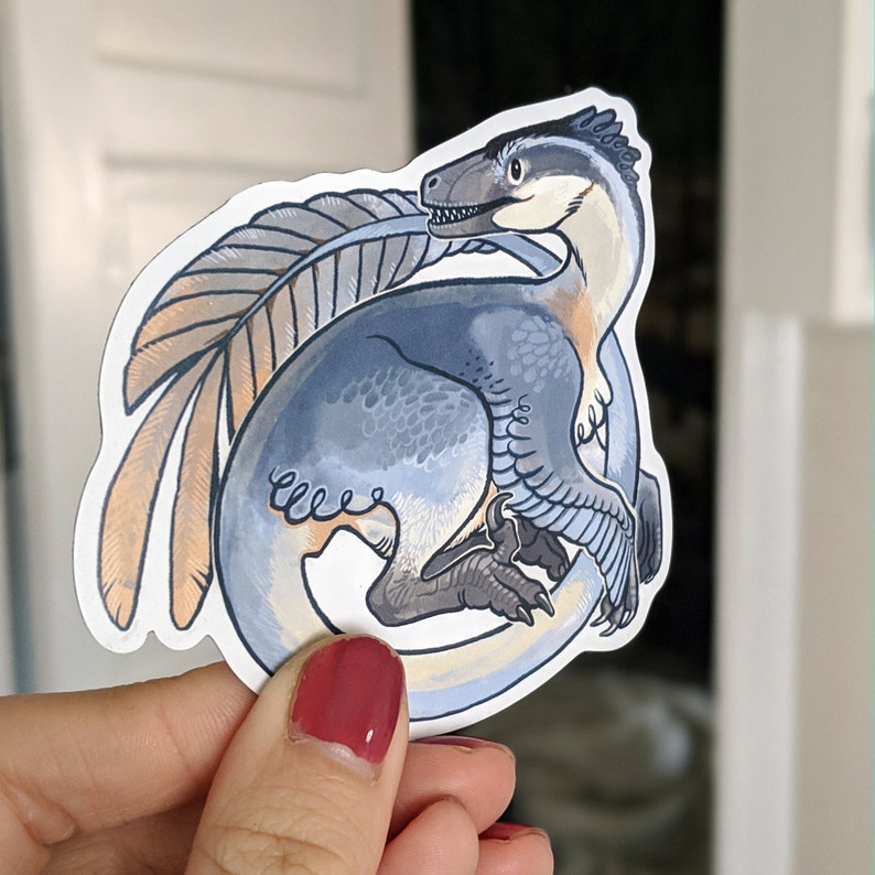 blue feathered raptor