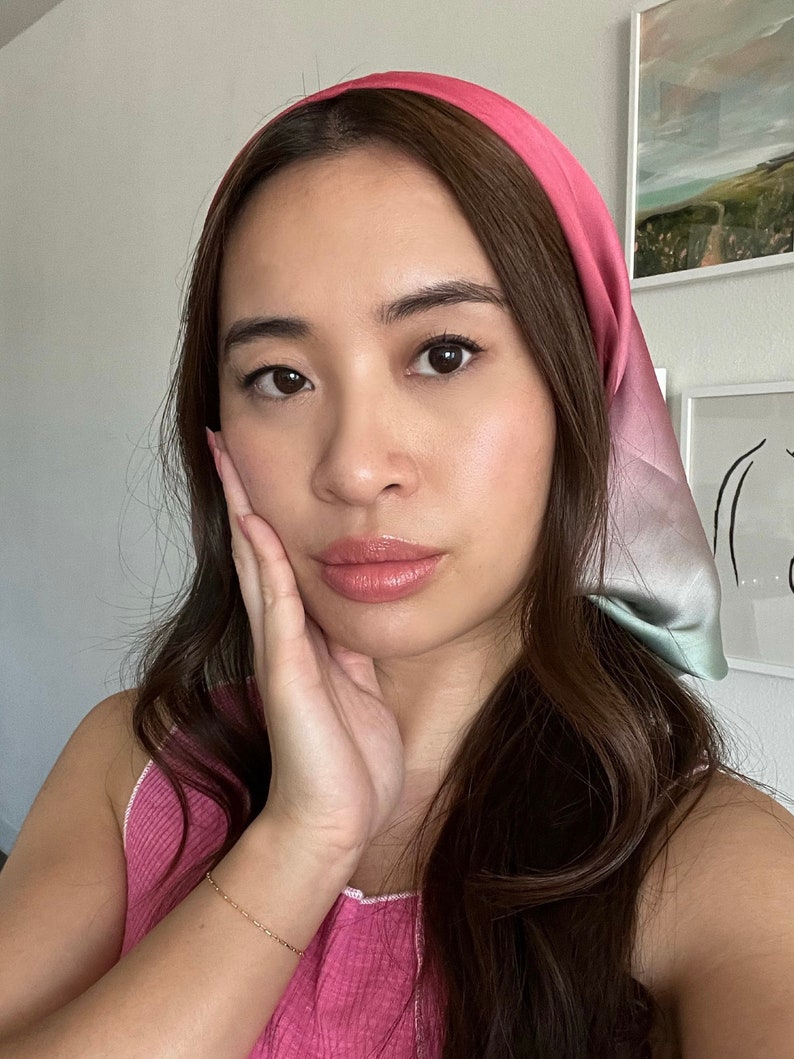 woman wearing a watermelon looking scarf