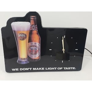 Insegna luminosa vintage Amstel Light Beer, pubblicità su orologio da parete o da banco
