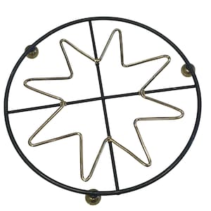May include: A round, black metal trivet with a gold starburst design in the center. The trivet has three small, gold-colored feet and is designed to protect surfaces from hot cookware.