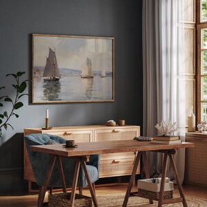 a room with a desk and a painting on the wall