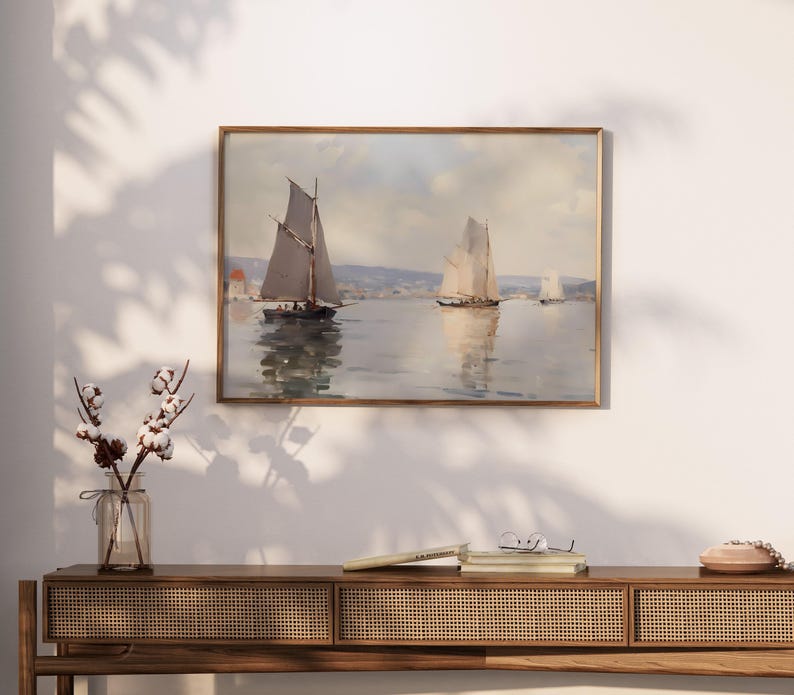 a painting hanging on a wall above a table