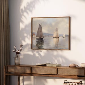 a painting hanging on a wall above a table