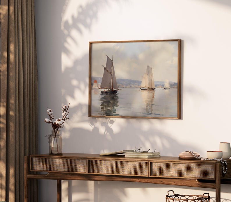a painting hanging on a wall above a table