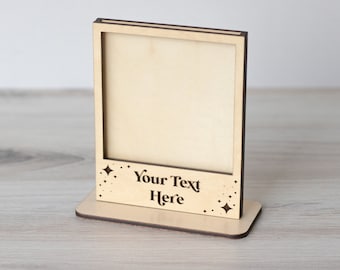 May include: A wooden picture frame with a stand. The frame has a cutout design of stars and the text "Your Text Here".