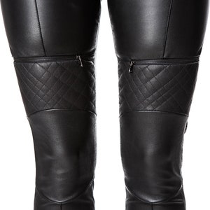 May include: Black leather pants with a quilted detail on the knees. The pants have a zipper detail on the sides of the knees.